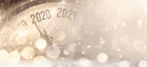 A festive clock face showing the transition from 2019 to 2020 and 2021, representing the risk of remaining stagnant in 2020.