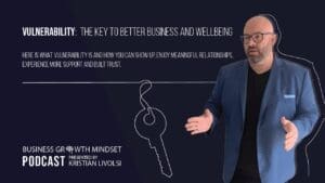 Kristian Livolsi in a blue blazer on a better business podcast episode explaining how vulnerability improves wellbeing.