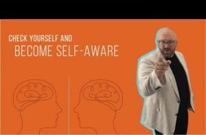 Kristian Livolsi pointing toward the viewer on the Business Growth Mindset Podcast, highlighting the importance of becoming self-aware.