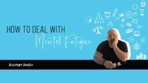 Kristian Livolsi looking exhausted with his head in his hand, illustrating how to deal with mental fatigue in business.